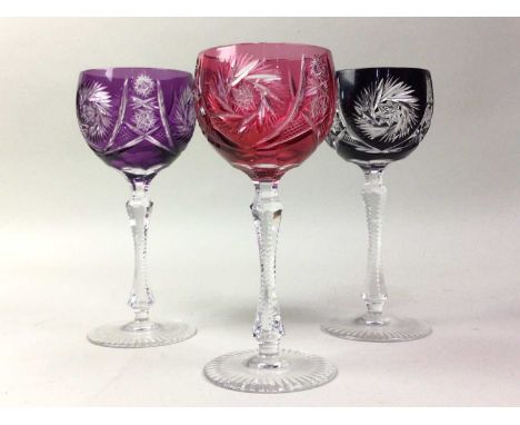 SET OF SIX HARLEQUIN DRINKING GLASSES, ALONG WITH A RUBY CUT GLASS VASE each of the drinking glasses in a different colourvas