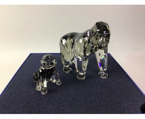 THREE SWAROVSKI CRYSTAL FIGURES, the first modelled a gorilla and two cubs, contained across two original boxesthe gorilla 10