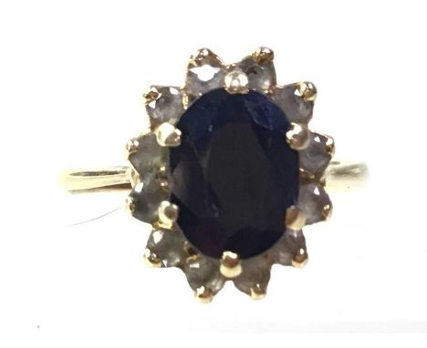 THREE DRESS RINGS, AND A PENDANT  one in silver, the others unmarked, along with a cluster pendant