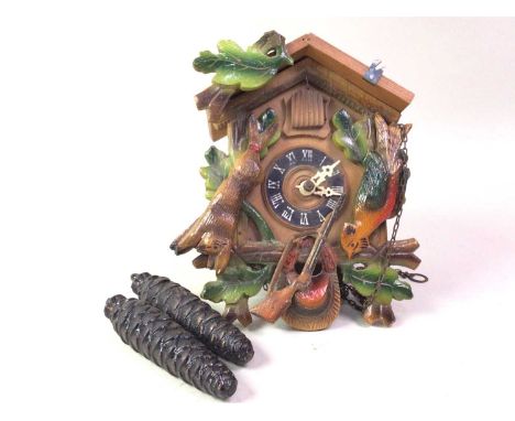 REPRODUCTION CUCKOO CLOCK, contained in a carved and painted wood case19cm high