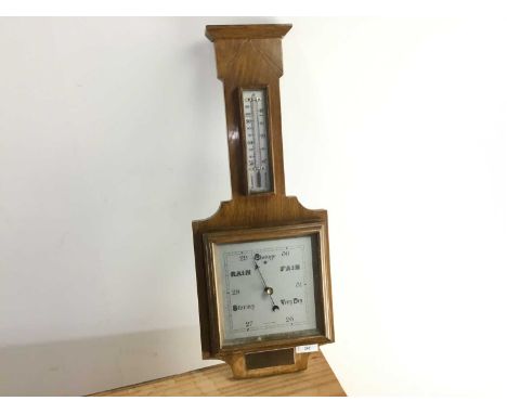 OAK WHEEL BAROMETER, with silvered dial, mounted presentation plaques56cm high