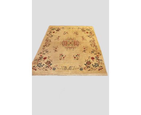 Indian carpet of modern production, 14ft. 11in. X 11ft. 9in. 4.55m. X 3.58m. Surface marks; colour run and areas of moth dama