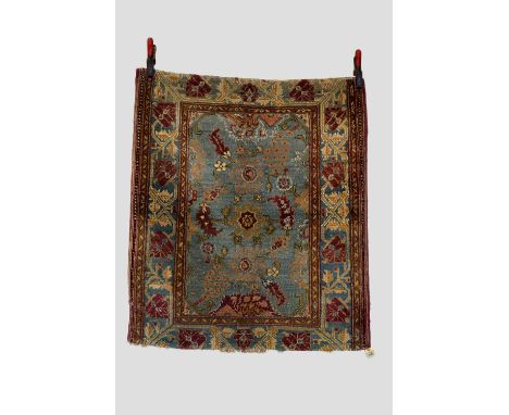 Agra rug, north India, early 20th century, 3ft. 8in. X 3ft. 2in. 1.12m. X 0.97m. Part of the main border and all outer guards