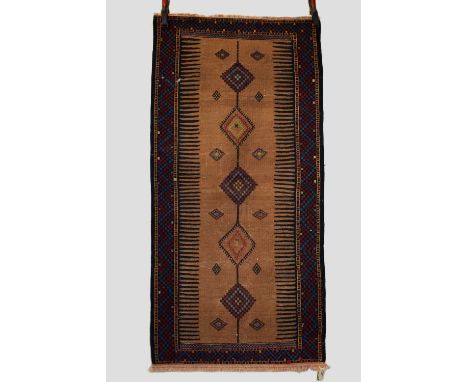 Four flatwoven rugs comprising a Baluchi sofreh, north east Persia, circa 1930s, 5ft. X 2ft. 6in. 1.52m. X 0.76m. Somewear; s