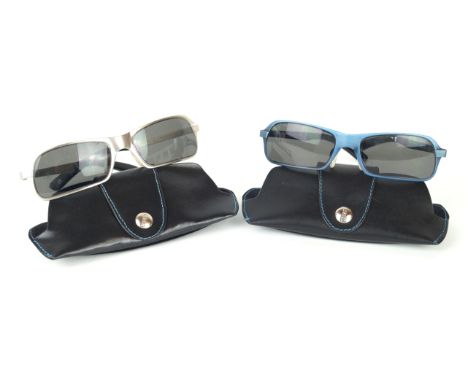 Versus by Gianni Versace: Two pairs of vintage sunglasses
Both with black lenses in metal frames, the first in brushed blue, 