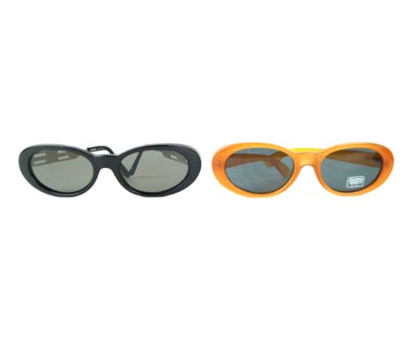 Versus by Gianni Versace: Two pairs of vintage sunglasses
Of similar design, the first in translucent burnt orange with a sig