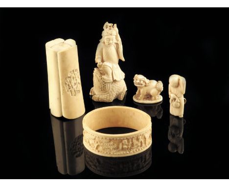 λ A Chinese carved ivory group of Liu Hai, standing on the three legged toad, a Chinese carved ivory box, the cover relief de