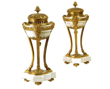 A pair of Louis XVI style ormolu and white marble perfume burners, each with a lift-off lid with a cone finial above a pierce