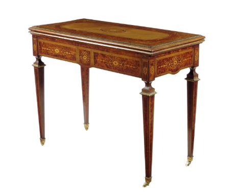 A late Victorian thuya and marquetry card table, with gilt brass mounts, the hinged, swivel and fold-over top with a harewood