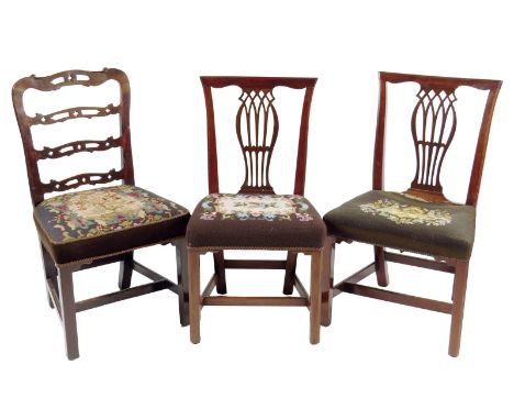 Two George III Irish mahogany side chairs, each with a moulded top rail above a pierced splat and a needlework seat, together