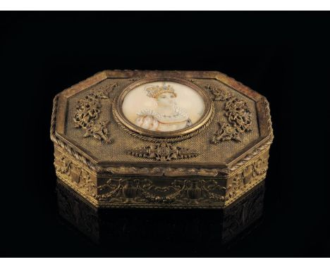 λ A late 19th century French gilt metal jewellery box, the hinged lid inset with a portrait miniature on ivory of a queen, si