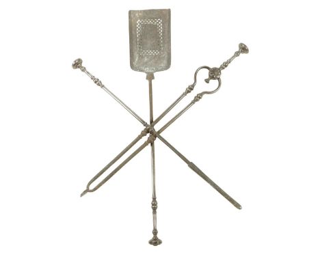 A set of three 19th century steel fire tools, each with a disc finial handle and a knopped stem, with a pierced pan, 75cm lon