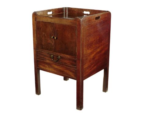 A George III mahogany tray-top bedside commode, the gallery pierced with three handgrips above a cupboard and a pull-out base