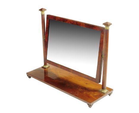 A Regency mahogany dressing table mirror by William Wilkinson, the rectangular plate within a flame veneered frame with turne