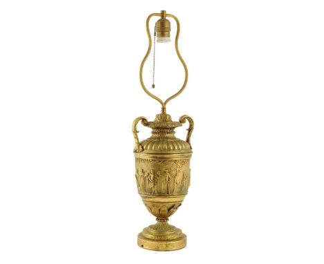 A late 19th century ormolu vase table lamp, with leaf scroll handles, the body cast with classical figures, stamped with init