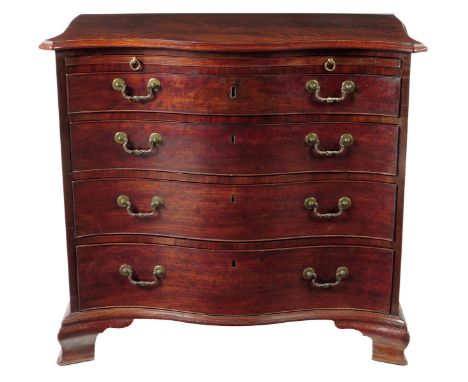 A George III and later mahogany serpentine commode, the moulded edged top above a baize lined brushing slide and four graduat