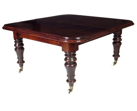 An early Victorian mahogany extending dining table, the top with a moulded edge on a telescopic frame extending to accommodat