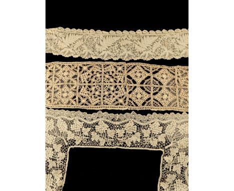 A fine early 19th century Honiton lace collar, worked with raised and rolled work of ferns, oak leaves, acorns and forget-me-
