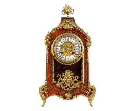 λ A late 19th century French tortoiseshell and brass boulle marquetry mantel clock, the eight day movement striking on a gong