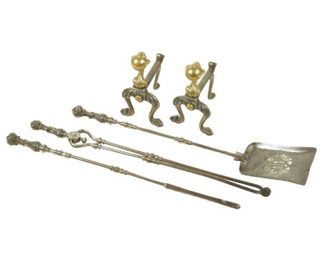 A set of three early Victorian steel fire tools, each with a lappet cast handle and knopped stem, with a pierced pan, 71.5cm 