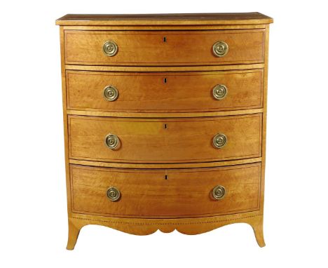 A Regency bird's eye maple bowfront chest, inlaid with stringing, with a crossbanded mahogany top and sides, with four long g