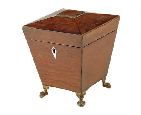A late Regency partridge wood sarcophagus shape tea caddy, inlaid with ebonised stringing, with a bone escutcheon, the interi