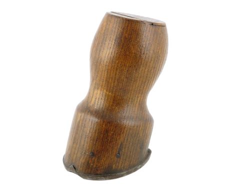 Treen. A 19th century ash hoof snuff box, with a hinged lid, with an iron horseshoe base, 12.1cm high.
