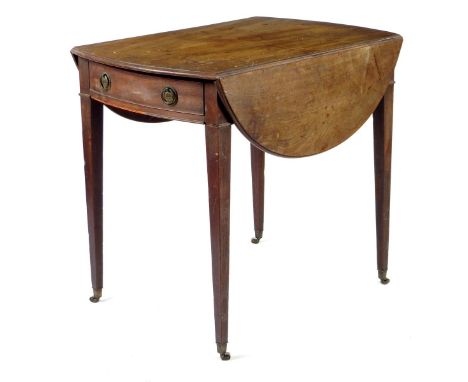 A George III mahogany bowfront Pembroke table, the oval drop-leaf top above a frieze drawer, on brass roller castors, 70.7cm 