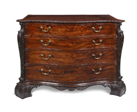 An early George III mahogany serpentine dressing-commode attributed to William Gomm, the crossbanded top with a floret carved