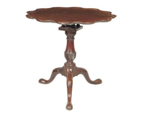 An early George III mahogany tripod table, the circular tilt-top with a piecrust edge, revolving on a birdcage on a turned an