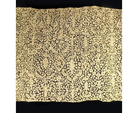 An early 18th century Flemish bobbin lace flounce, decorated with flowers, foliage and figures, 340 x 47cm.