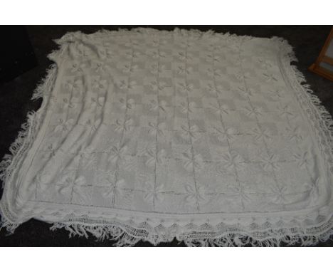 An antique white knitted bed spread,approx 98' X 76',good condition.