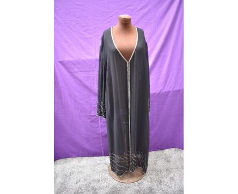 An art deco beaded flapper coat, larger size and in good order for age.