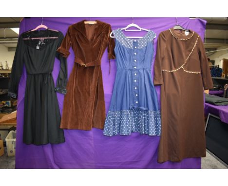 Four vintage dresses including blue 1950s with polka dot accents and 1970s brown velvet with belt.