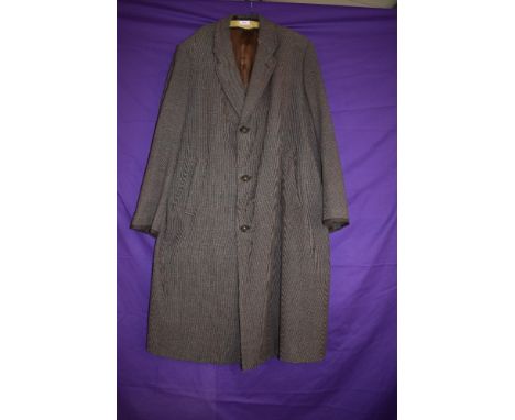 A vintage gents wool/wool blend overcoat having vent to back and pockets to front.