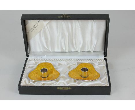 A pair of Danish silver and yellow enamel taper sticks / candle holders by Meka, marked 925S Meka Sterling Denmark 2cm high, 