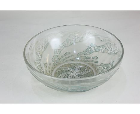 A Lalique 'chiens' glass bowl with green accents, decorated with dogs, raised mark R Lalique, 24cm diameter