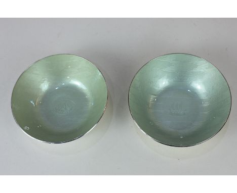 A pair of silver and pale green enamel bowls by Grete Prytz Kittelsen for Jacob Tostrup, with central sailing ship design, st