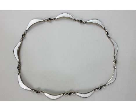 A Norwegian silver gilt and white guilloche enamel necklace by Albert Scharning, each curved link separated by a black circul