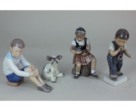 Three Dahl Jensen Copenhagen porcelain figures of a young girl holding a doll, 15.5cm, a boy playing with a pipe, 17cm, and a