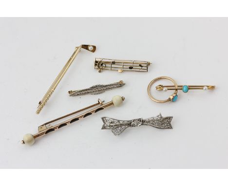 A group of five gold bar brooches including a diamond set example, a child's turquoise ring and bar brooch
