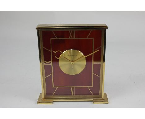 A Jaeger-LeCoultre eight day mantel clock with square brass case and imitation tortoiseshell dial, with original box and pape