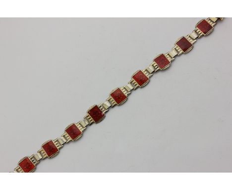 A Norwegian silver gilt and red guilloche enamel bracelet, each link with floral design