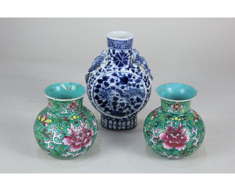 A Chinese blue and white porcelain moon flask decorated with birds amongst flowers and foliage, 16cm, together with a pair of