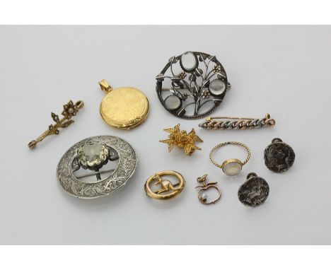 A gold locket, four gold brooches, silver and moonstone brooch, Scottish style brooch, moonstone ring, pendant, and silver ea