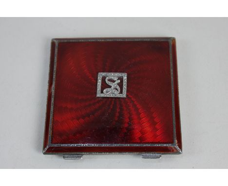 A George V silver and red guilloche enamel compact, makers Asprey &amp; Co, Birmingham 1933, with rose cut diamond 'S' monogr