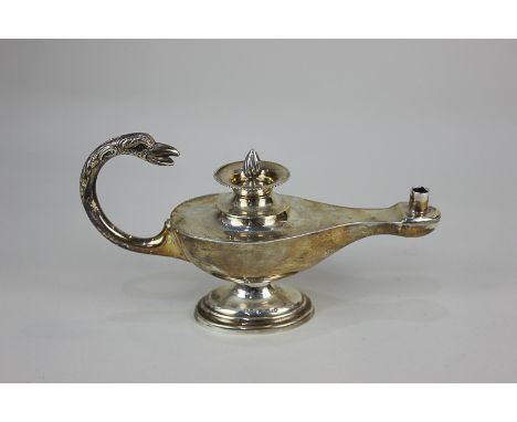 A George V silver table lighter in the form of an oil lamp, with bird head finial handle, maker Henry Matthews, Birmingham 19