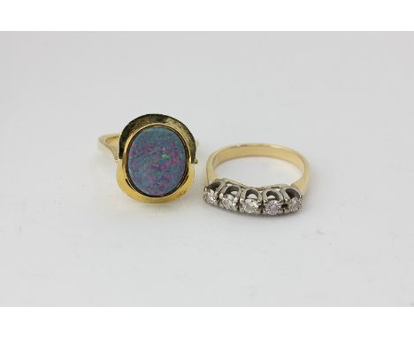 A diamond five-stone ring and an 18ct gold and opal ring