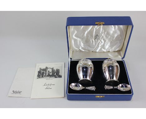 A cased pair of George VI silver tea caddies with matching caddy spoons, makers Reid &amp; Sons Ltd, Birmingham 1938, in the 