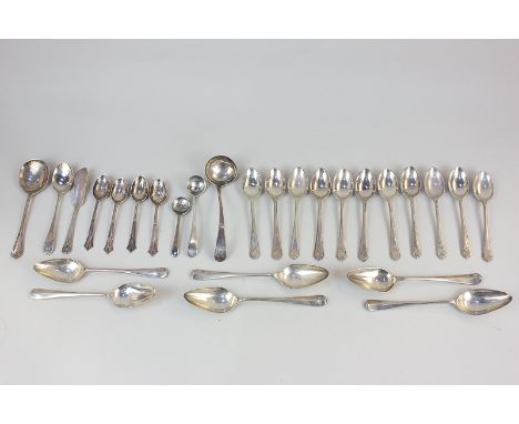 A George III silver sauce ladle, maker William Sumner, London 1789, together with a set of eleven teaspoons with golfing fini